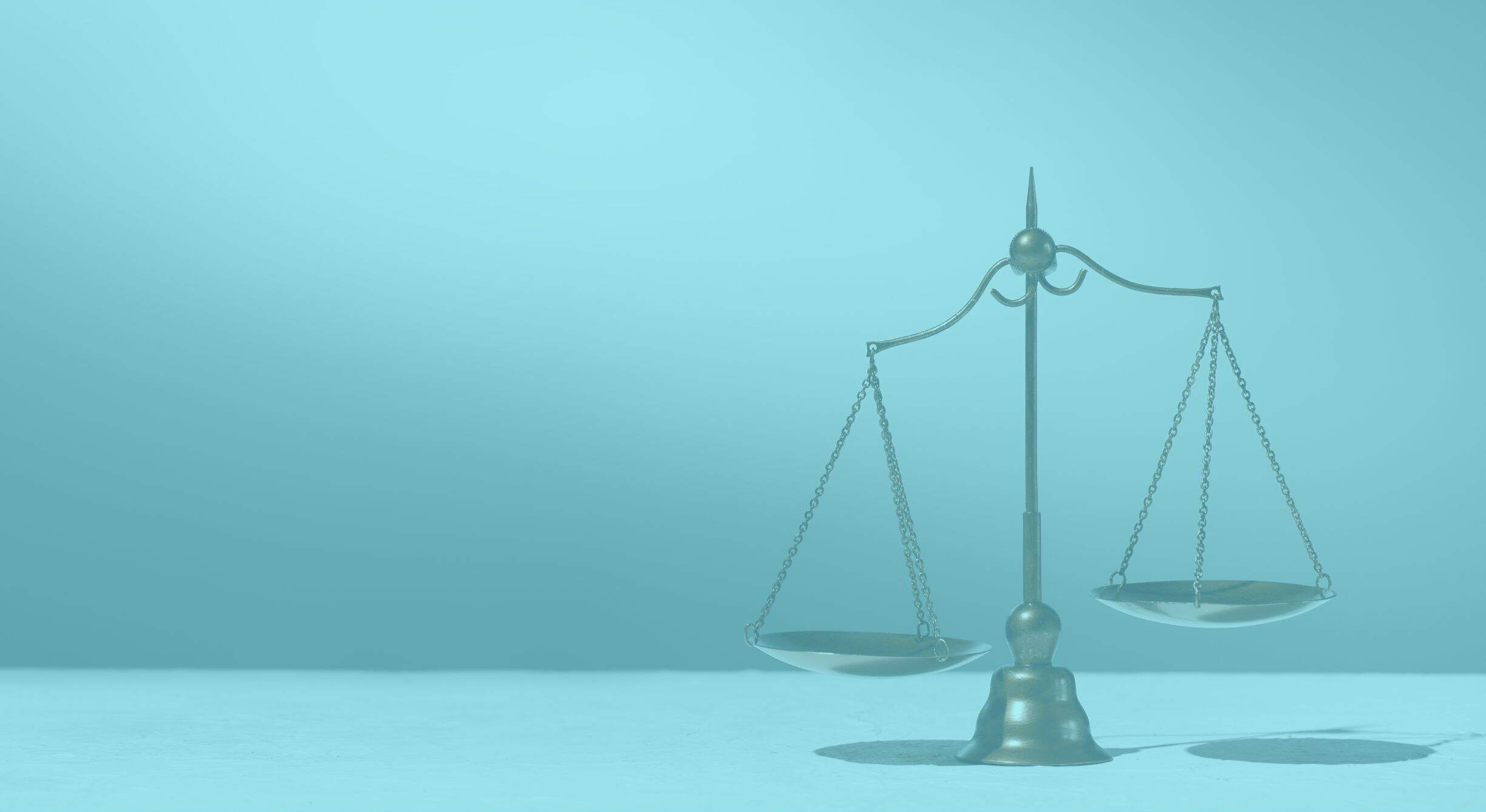 Scales of justice on a grey background